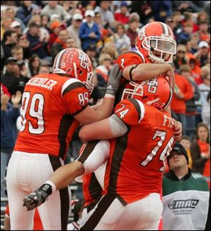 The Falcons' Corey Partridge gets a lift from Jimmy Scheidler, left, and Jeff Fink after scoring against Kent State.
<br>
<img src=http://www.toledoblade.com/graphics/icons/photo.gif> <font color=red><b>VIEW</font color=red></b>: <a href=