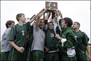 Ottawa Hills lifts the trophy after defeating Lake to capture the Division III boys soccer regional title yesterday.
<br>
<img src=http://www.toledoblade.com/graphics/icons/photo.gif> <font color=red><b>VIEW</font color=red></b>: <a href=