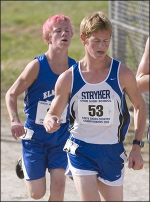 Stryker's Kenny Graber leads an Elmwood runner in the
Division III race. Elmwood placed eighth and Stryker 15th. 