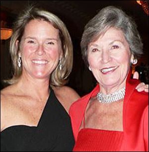 Daughter Lisa Silverman, left, and mom Nancy Metzger light up the Junior League anniversary.
<br>
<img src=http://www.toledoblade.com/graphics/icons/photo.gif> <b><font color=red>VIEW</b></font color=red>: <a href=