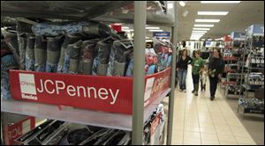 Penney, which said sales fell 13 percent from a year ago, was among stores cutting profit forecasts. DVDs attract shoppers at Wal-Mart, one of the few bright spots in the monthly statistics.