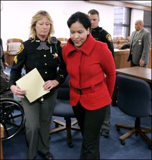 Karyn McConnell Hancock leaves court after her plea. Sentencing is Jan. 15. She could receive up to eight years in prison.