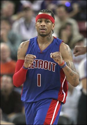 Allen Iverson, who had 30 points in his first win with the Pistons, pumps his fists after making two late free throws.