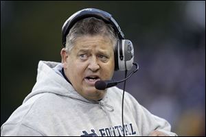 ND's Charlie Weis has not won most of his games, but he does graduate most of his players and recruits well, says his boss.