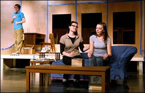 Zak Striggow, left, Christine Scharer, and Megan Guidry go through a scene during rehearsal.