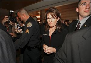Alaska Gov. Sarah Palin, as she arrives at the 2008 Republican Governors Association in Miami, was largely kept away from the media as she campaigned with Sen. John McCain.
