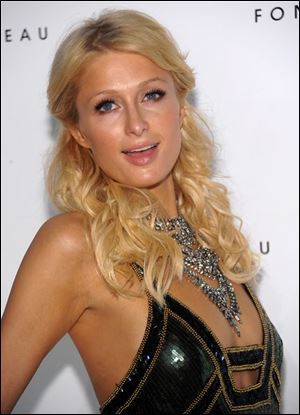 Word on the streets is that Paris Hilton is breaking up with her rock star boyfriend Benji Madden and that the cad behind the split was Prince William. Yikes!!!!