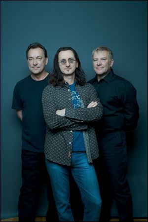 Rush is (l-r) Neil Peart, Geddy Lee, and Alex Lifeson.