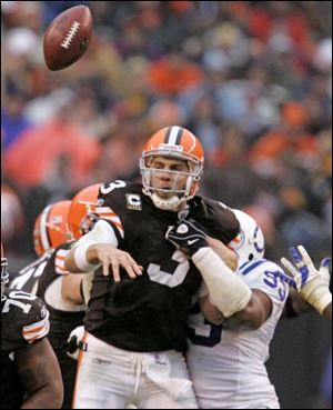 The Browns' Derek Anderson fumbles the ball after being hit by the Colts' Dwight Freeney. Indianapolis' Robert Mathis picked up the loose ball and ran it 37 yards for the game-deciding touchdown.