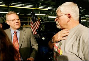 Chrysler LLC vice chairman Tom LaSorda, left, and Jeep worker Gary Stephens of Lambertville discuss the bailout plan.