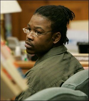 Dounche Jones listens to testimony during his trial. Yesterday, after three days of testimony from 19 witnesses and 40 pieces of evidence, the jury found the 20-year-old guilty of killing David Babcock, 46, in July. Jones could get an 18-year-to- life sentence.