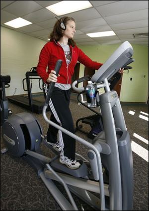 Joanne Becker of Rossford, above, uses the new Cardio Room in the Rossford Community Recreation Center. 