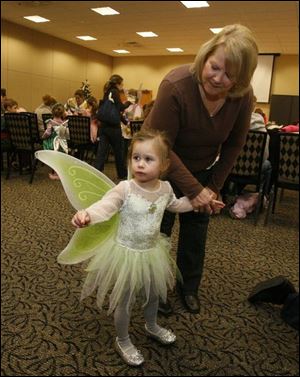 nbrn fairy04p 11/30/2008  blade photo by herral long   Ellie Nichols and grandmother Carol Nickoloff  both of monroe     dress up event  for the showing of the movie Tinker Bell at Bedford library