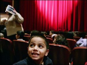 CTY christmas04p 12/04/08  The Blade/Dave Zapotosky Caption: Andres Pecina 5, a kindergarten student at Queen of Apostles School, looks around the Valentine Theatre in Toledo, Ohio, before watching the performance of the  "Night Before Christmas" Thursday, December 4, 2008. Summary: Valentine Theatre performance of "Night Before Christmas" for school kids.