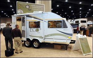 A towable RV features thermal-plastic walls, floor, and roof.