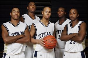 All five starters from St. John's Jesuit's 17-7 team returning this year are, from left, Cheatham Norrils, Tim Simmons, Michael Taylor, Tim Kynard and Jay Springs. They will be trying to capture the Titans' 12th City League basketball championship.