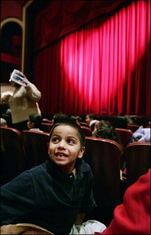 CTY christmas04p 12/04/08  The Blade/Dave Zapotosky Caption: Andres Pecina 5, a kindergarten student at Queen of Apostles School, looks around the Valentine Theatre in Toledo, Ohio, before watching the performance of the  