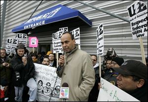 U.S. Rep. Luis Gutierrez, a Chicago Democrat, addresses protesters outside the Republic plant on Saturday.