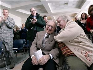 CTY honor08p 12/07/08  The Blade/Dave Zapotosky Caption: Arthur "Jibby" Jibilian, a Fremont resident who was a radio officer with the Office of Strategic Services during Operation Halyard in WWII, is comforted by his wife Jo after being overcome with emotion while receiving a standing ovation during a ceremony in his honor at the 180th Fighter Wing Air National Guard base, at Toledo Express Airport in Swanton, Ohio, Sunday, December 7, 2008.  Jibilian was honored for his role in the rescue of 500 Allied Airmen in Serbia during WWII. Summary: Please get shots at the ceremony, hosted by the 180th Fighter Wing, that will honor Arthur "Jibby" Jibilian, a Fremont resident who was a radio officer with the Office of Strategic Services during Operation Halyard in WWII.