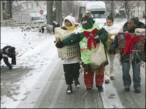 NBRE parade11p   12/06/2008     BLADE PHOTO/Lori King  Kids from East Toledo Family Center's Success After School program march during annual Christmas parade in East Toledo, OH.