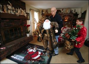 John and Carla Bocskay brighten their Deerfield home with holiday decorations in preparation for the upcoming tour of businesses, churches, and homes in the Petersburg area.