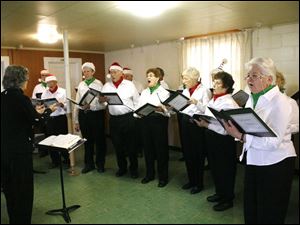 nbrw burkey18p 12/11/08   The Blade/Herral Long  Elaine Keller of   Waterville directs   syvania choie    The sylvania seniors sing for the Berkey seniors at the  at Richfield  Town hall
