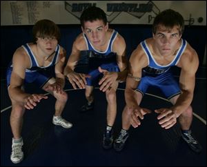 Elmwood has its sights set on a Suburban Lakes League championship with top wrestlers, from left, Cody Alexander, Alex Betts and Jordan Ackley.