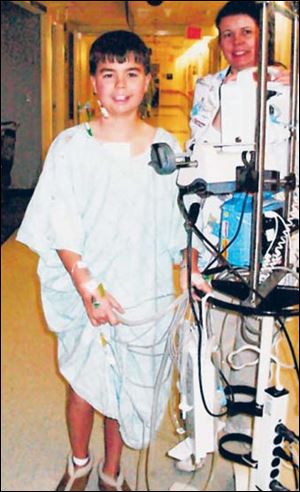 Johnny Stout smiles for the camera while he recuperates from open heart surgery in December, 2006.