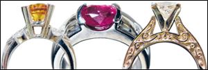 Left: Engagment ring with yellow center stone. Center: White gold fashion ring has an oval ruby and diamonds. Right: White gold ring has scrollwork on both sides.