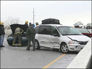 Authorities work to clean up an accident on I-75 and Phillips on December 26, 2008.