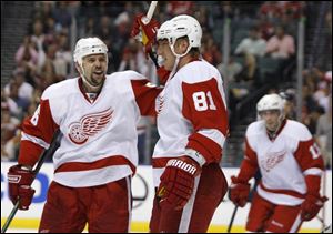 Detroit s Tomas Holmstrom, congratulating teammate Marian Hossa (81), hails from Pitea, Sweden, not far from the North Pole.