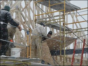 biz build28p 12/23/08   The Blade/Herral Long  stand alone construction art  of Co-op toledo credit union  2422 S. Holland Sylvania rd            Jim Buyakie