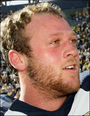 Toledo quarterback Aaron
Opelt savors the Rockets 
13-10 victory over Michigan.