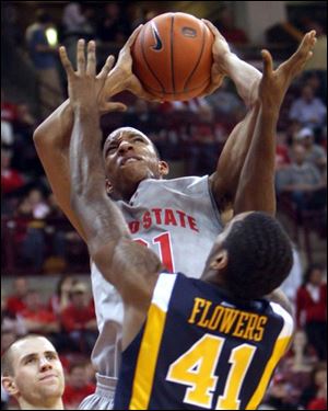 Ohio State's Evan Turner goes up for a shot over West Virginia's John Flowers (41). Turner finished with 10 points.