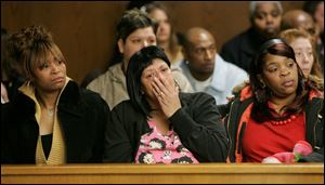 Relatives of victim Donald Lee look on as Robert Parker is arraigned in Toledo Municipal Court. 