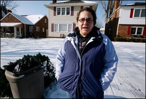 Melissa Miller is among 20 percent of Toledoans who had difficulty with the city's new trash pickup arrangement. She says she was about to place her trash out at the curb on the normal pickup day before being reminded of the schedule change. Pickup dates will rotate according to holidays to avoid paying overtime.