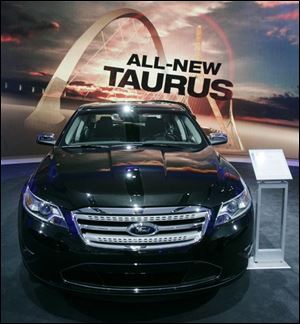 The light bar on the front corners of the 2010 Ford Taurus helps save fuel by reducing the load on the engine of the redesigned flagship sedan.