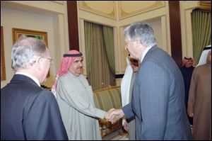 Dan Johnson, right, greets Sheikh Hamden bin Rashid Al Maktoum, deputy ruler of Dubai. Mr. Johnson now heads Zayed University, a federal university supported by the United Arab Emirates, Dubai, and Abu Dhabi. There is no tuition for students of the UAE.
