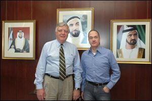 Allan Block, chairman of Block Communications Inc., parent company of The Blade, visits Zayed University in the United Arab Emirates with Dan Johnson, left, former president of the University of Toledo. Mr. Johnson is provost, chief operating officer, and chief academic officer of Zayed University in the Emirate of Dubai. Behind them are portraits, from left, of Sheikh Khalifa bin Zayed Al Nahyan, UAE president and ruler of the Emirate of Abu Dhabi; the late Sheikh Zayed bin Sultan Al Nahyan, founding president of the UAE, and Sheikh Mohammed bin Rashid Al Maktoum, the UAE's vice president and prime minister and ruler of Dubai.
