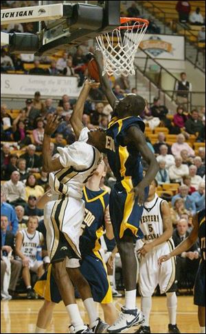 Rockets sophomore Justin Anyijong blocks a shot attempt by Western Michigan's LaMarcus Lowe. But Toledo quickly fell behind 25-2 and has now lost its last 23 of 24 road games.