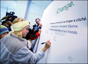 Maddie Freeman of Ottawa Hills Elementary adds her name to the message of change going to next week's inauguration.