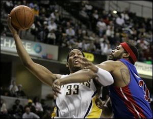 Pacers forward Danny Granger, left, is fouled by Pistons center Rasheed Wallace as he goes up for a shot in overtime.