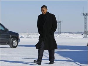 President-elect Barack Obama arrives at Cleveland International Airport in Cleveland, Friday, Jan. 16, 2009.