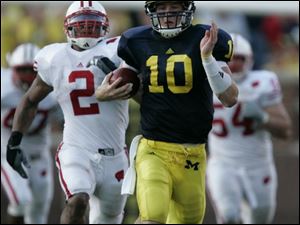 Michigan quarterback Steven Threet, shown breaking free against Wisconsin, said he is counting on being the Wolverines' starter heading into the 2009 campaign.