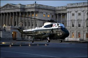 The helicopter that will escort outgoing President Bush after the inauguration of President-elect Barack Obama arrives outside the U.S. Capitol in Washington on Tuesday.