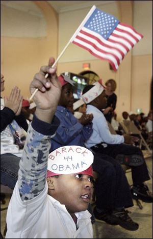 Davion Crockett, 6, and his peers stare intently at the television during President Obama's inauguration ceremony.