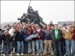 The Marine Corps War Memorial forms a backdrop for students from St. Francis de Sales High School, who were among several Toledo and area student groups who traveled to Washington for yesterday s inauguration.  