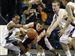 Comfortable-Rockets-top-Chips-at-home-3.jpg With Ian Salter applying pressure, Toledo guard Larry Bastfield, left, reaches for the ball but winds up grabbing the arm of Central Michigan s Robbie Harmon last night at Savage Arena.