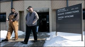 City union workers depart AFSCME Local 7 hall on Reynolds Road after Thursday's vote on a new contract.