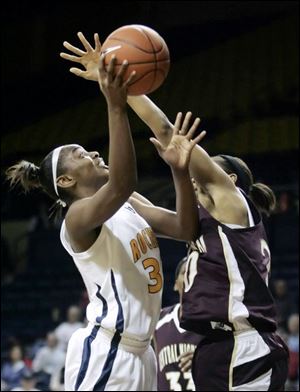 Tanika Mays works inside against Central Michigan's Latisha Luckett. Mays scored 15 for the Rockets, now 4-1 in the MAC.